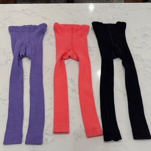 Hanna Andersson kids footless tights in Purple, Coral, and Black